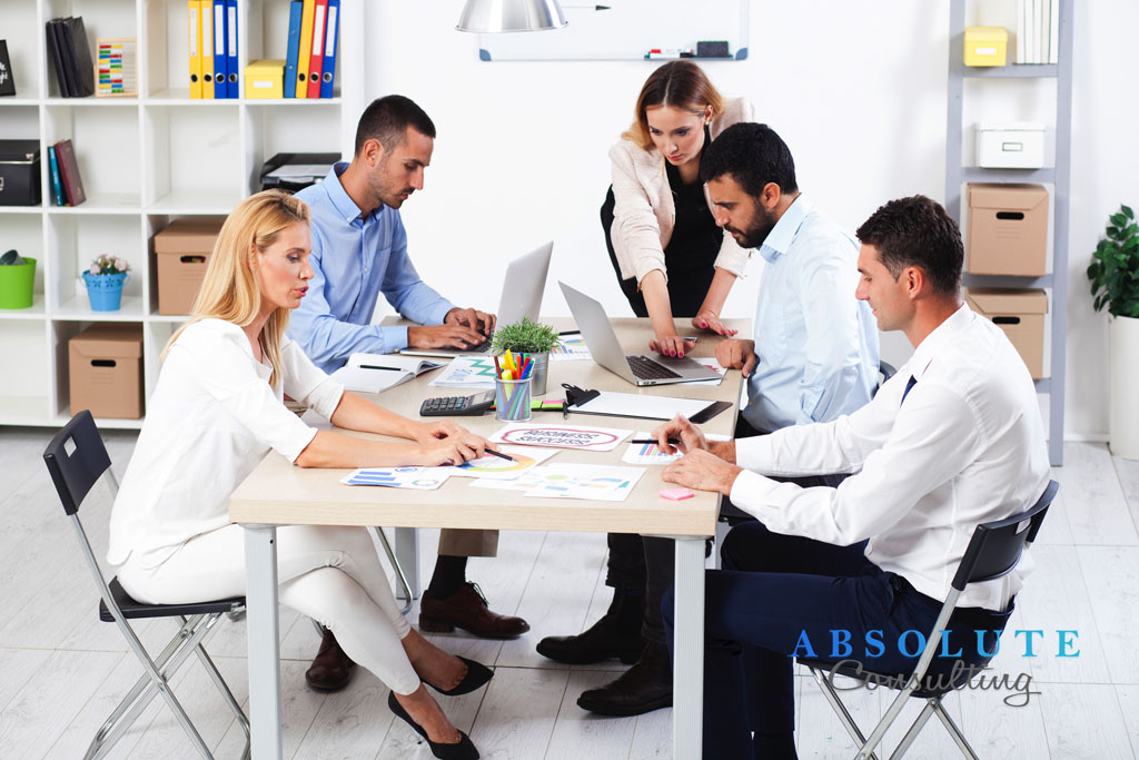 Group Of Business People Having Meeting In Office